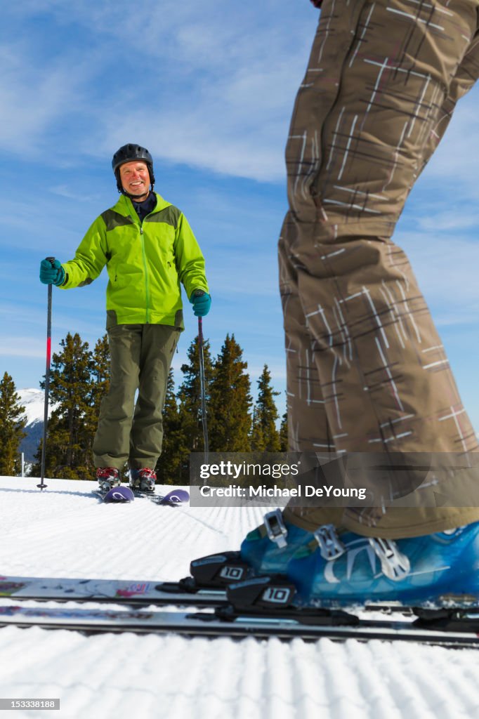 Caucasian couple skiing together