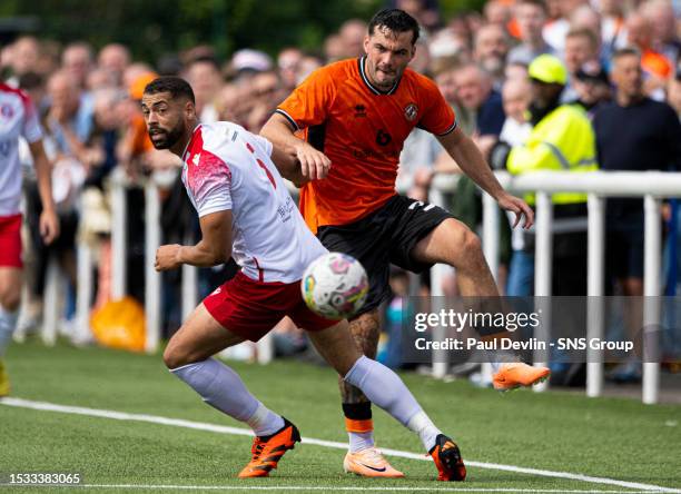 Dundee United's Tony Watt and Spartans' Jordan Tapping in action during a Viaplay Cup group stage match between Spartans and Dundee United at Ainslie...