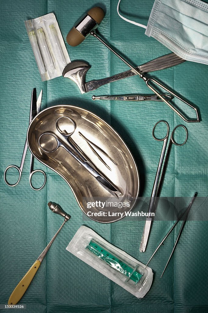 Various surgical instruments on a surgical drape