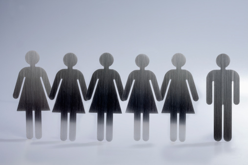 Five female restroom sign figures in a row and one male restroom sign figure Five female restroom sign figures in a row and one male restroom sign figure