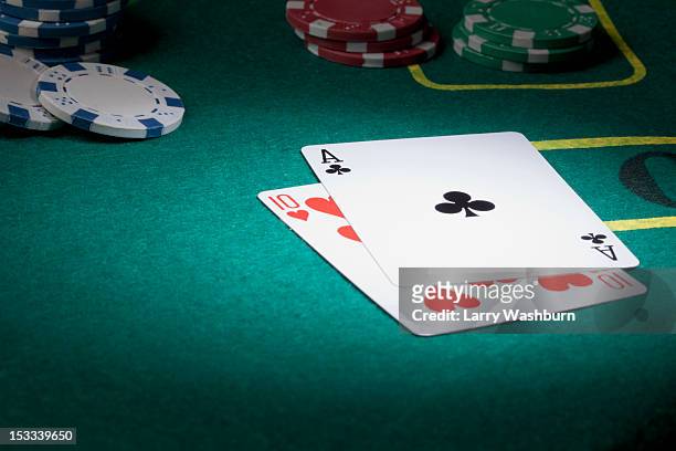 a blackjack hand displaying twenty-one - blackjack table stock pictures, royalty-free photos & images