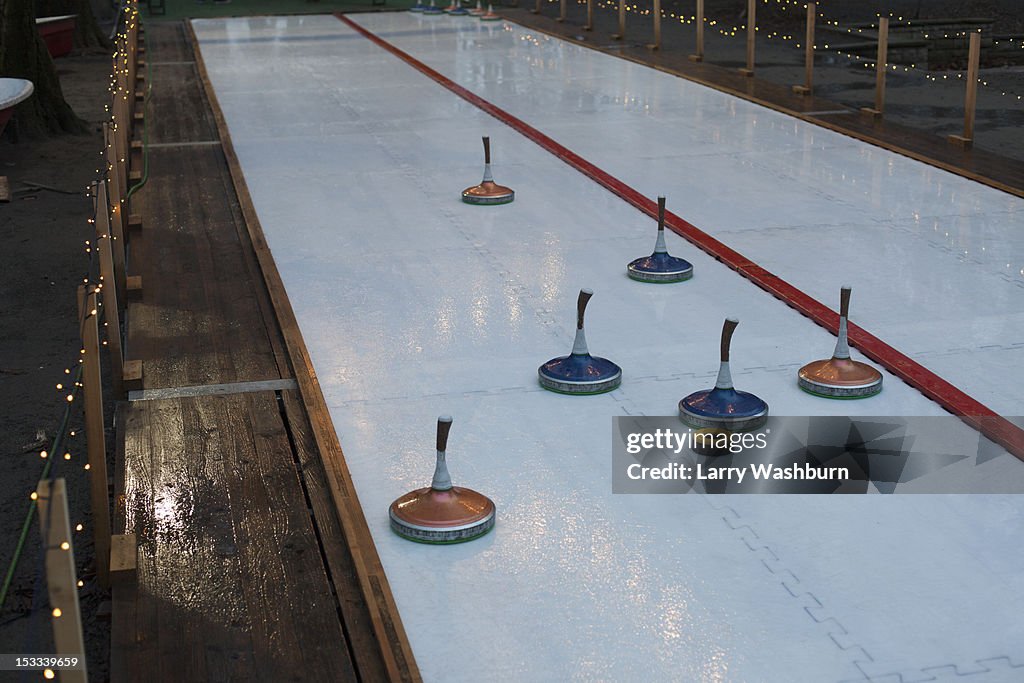 Curling stones on a curling sheet