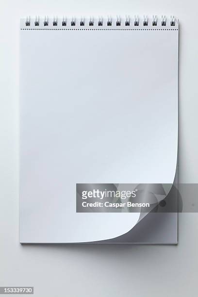 a blank sketch pad with curled up page corner - sketch pad stock pictures, royalty-free photos & images