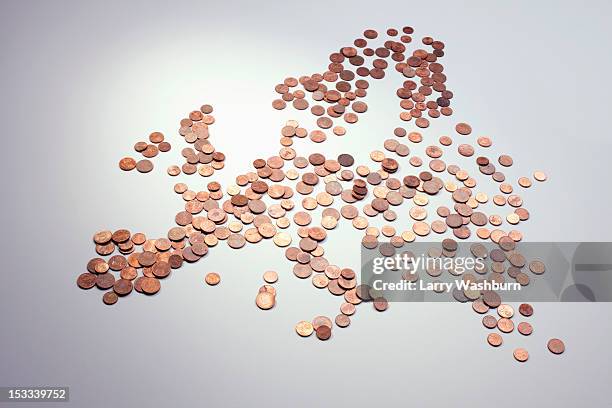 european union coins arranged into the shape of europe - european union currency stock-fotos und bilder