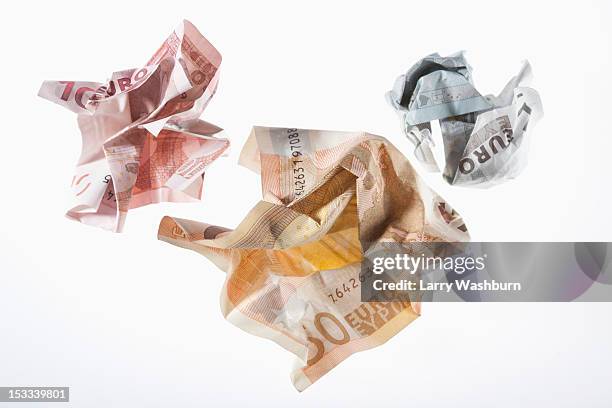 crumpled euro banknotes on a white background - crumpled fotografías e imágenes de stock