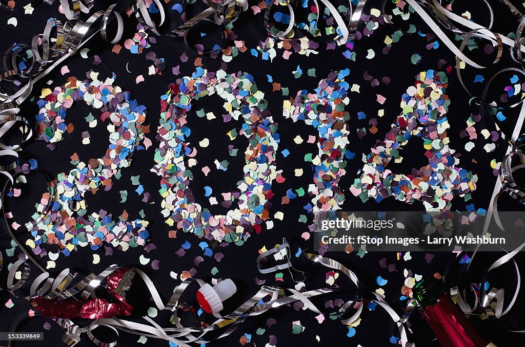 The year 2014 spelled out with confetti and surrounded by streamers