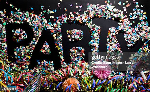 the word party stenciled in confetti - part horn blower stock pictures, royalty-free photos & images