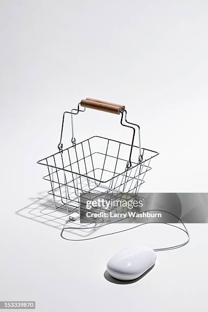 computer mouse connected to shopping basket for online shopping - convenience basket stock pictures, royalty-free photos & images