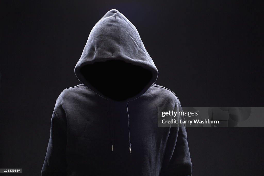 Hidden man in hooded top