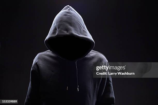 hidden man in hooded top - man and his hoodie stockfoto's en -beelden