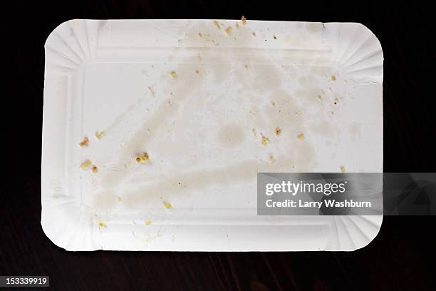 greasy stain from pizza slice on paper plate - paper plate stock pictures, royalty-free photos & images