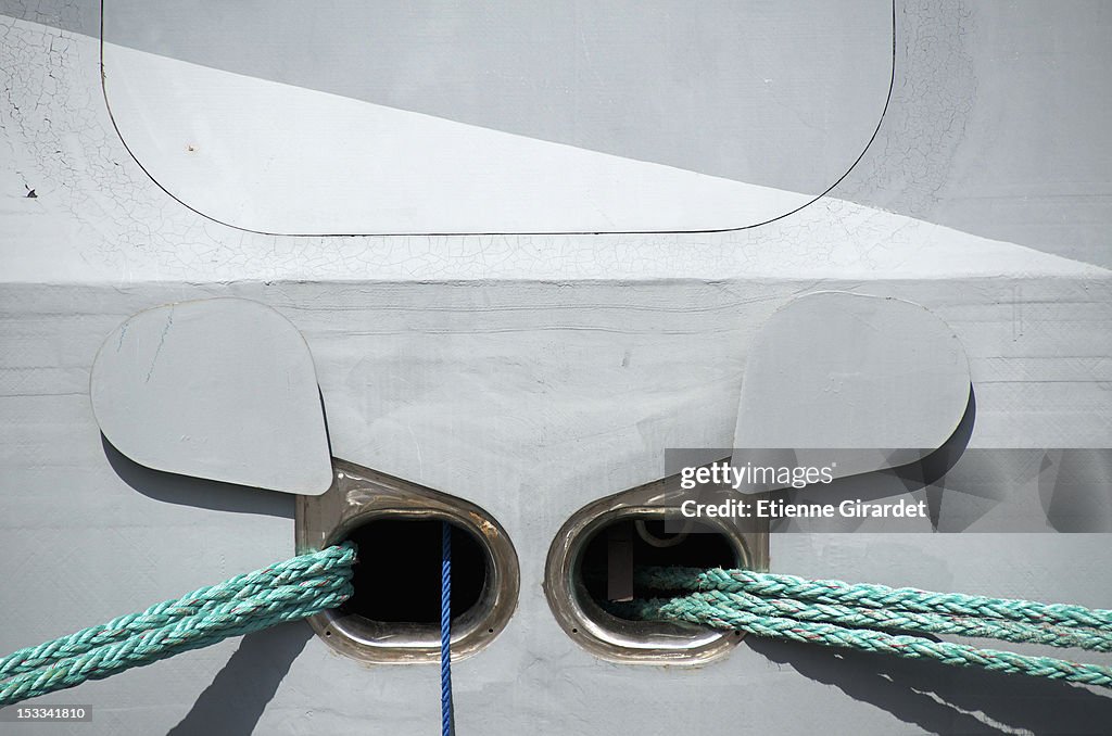 Outlets for ropes on a moored boat