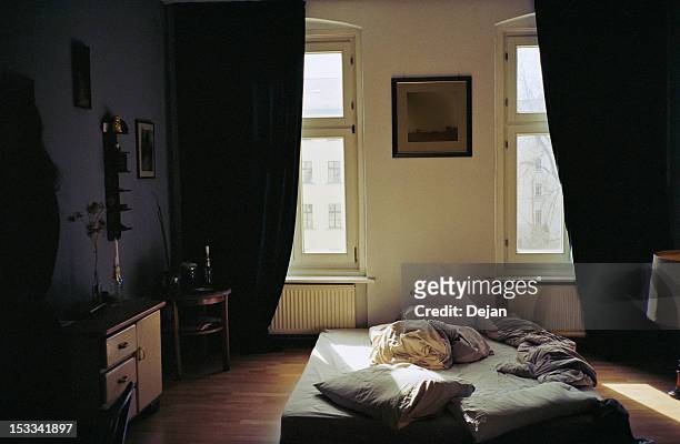 apartment bedroom in the morning - messy bedroom stock-fotos und bilder