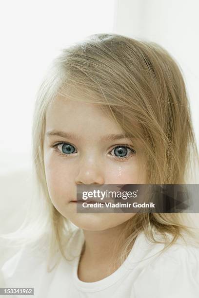 a young girl with a tear falling down her cheek - girl wet casual clothing stock pictures, royalty-free photos & images