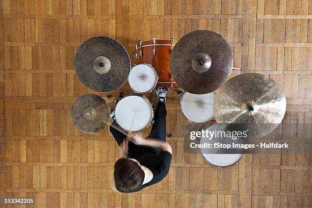 drummer plays kit - drums stock-fotos und bilder