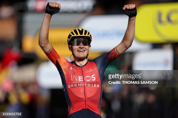 Grenadiers' Spanish rider Carlos Rodriguez Cano cycles to the finish line to win the 14th stage of the 110th edition of the Tour de France cycling...