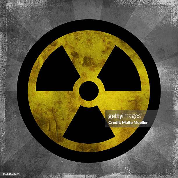 nuclear sign with dark sun rays emanating from the symbol - sun safety stock illustrations