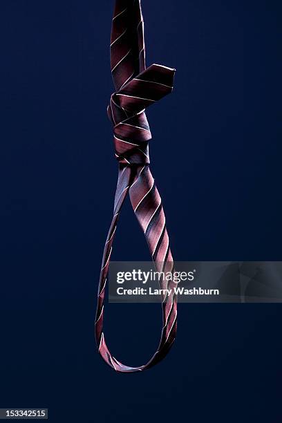 a striped necktie tied into a noose - noeud coulant photos et images de collection