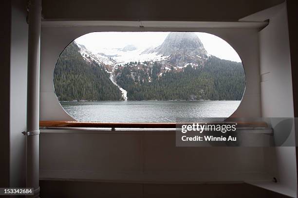 view of tracy arm fjord through the window of a passenger ship, alaska - porthole stock pictures, royalty-free photos & images