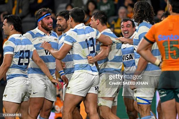 Argentina's Juan Martín González celebrates his try with teammates during the Rugby Championship match between Argentina and Australia at Commbank...