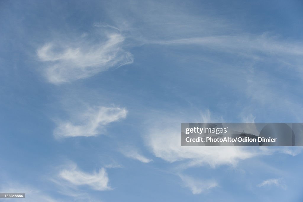 Wispy clouds in sky