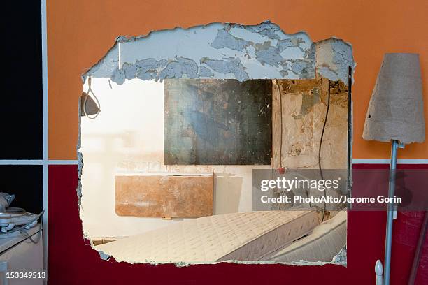 large hole in wall at demolition site - broken mattress stock pictures, royalty-free photos & images