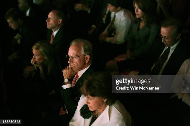 Members of the audience watch as Democratic presidential candidate, U.S. President Barack Obama debates Republican presidential candidate, former...
