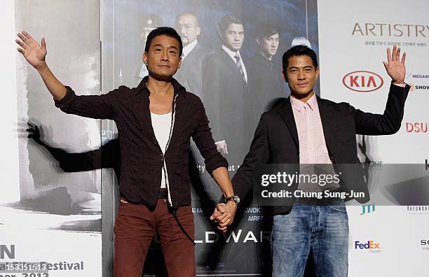 Actor Tony Leung Ka-Fai and Aaron Kwok attend at the opening film "Cold War" press conference during the 17th Busan International Film Festival at...