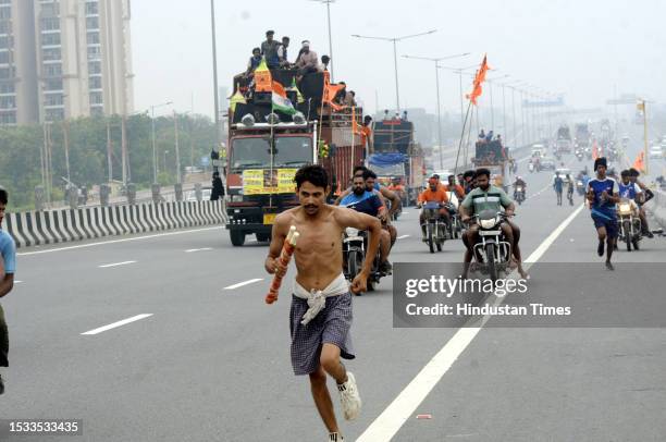 Thousands of Dak Kanwars throng at Delhi-Meerut Expressway on the penultimate day of Kanwar yatra, on July 15, 2023 in Ghaziabad, India.