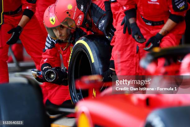 Ferrari mechanics prepare for a pit stop in the pit lane during the F1 Grand Prix of Great Britain at Silverstone Circuit on July 09, 2023 in...
