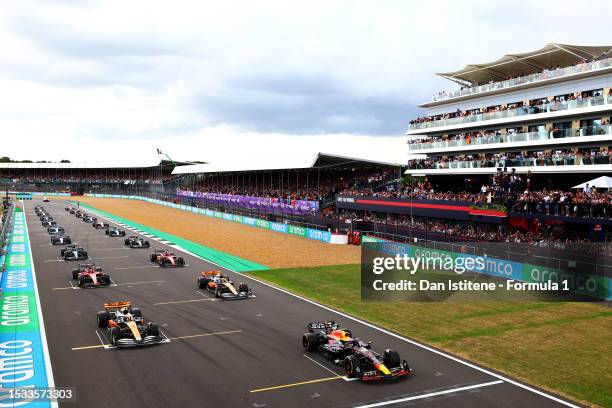 Max Verstappen of the Netherlands driving the Oracle Red Bull Racing RB19 and Lando Norris of Great Britain driving the McLaren MCL60 Mercedes line...