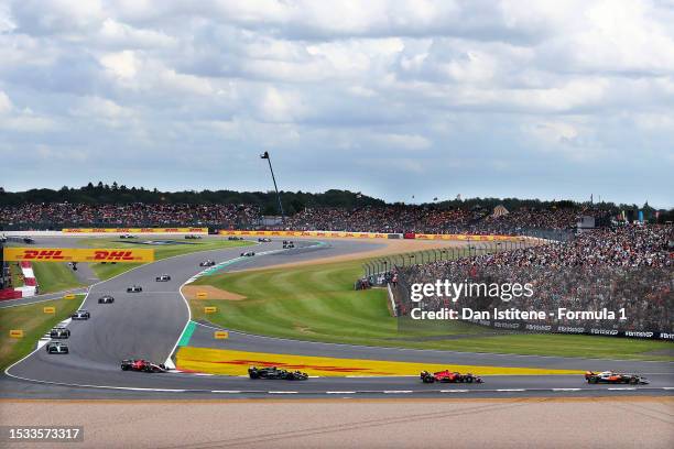 General view as Oscar Piastri of Australia driving the McLaren MCL60 Mercedes leads Charles Leclerc of Monaco driving the Ferrari SF-23, George...