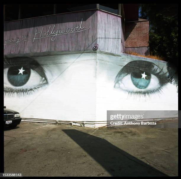 View of eyes painted on a wall in the parking lot of the Spago restaurant , West Hollywood, California, 1998. The restaurant original location, it...