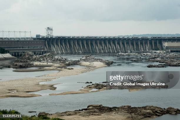 View of the DniproHES dam and the newly formed beaches of Khortytsia Island after the water level in Dnipro River fell, caused by the Kakhovka HPP...