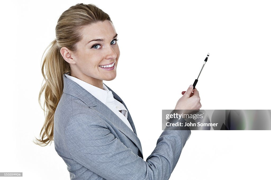 Businesswomen pointing to copy space