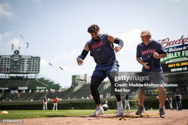 Kenley Jansen of the Boston Red Sox works out with strength and conditioning coach Kiyoshi Mimose before a game against the Chicago Cubs on July 15,...