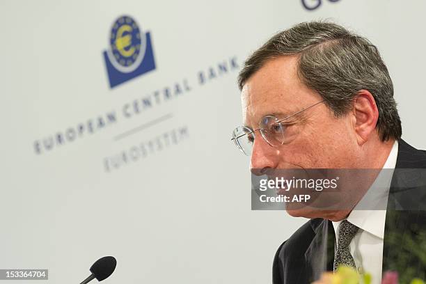 President of the European Central Bank Mario Draghi looks on during a press conference after the ECB Governing Council Meeting in Brdo, 60 km...