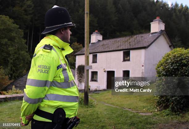 Police search Mark Bridger's house in the village of Ceinws as the hunt for missing April Jones continues on October 4, 2012 near Machynlleth, Wales....