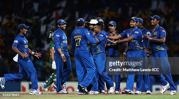 Rangana Herath of Sri Lanka is congratulated by team mates, after bowling Shahid Afridi of Pakistan during the ICC World Twenty20 2012 Semi Final...