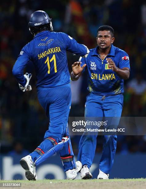 Rangana Herath of Sri Lanka is congratulated by Kumar Sangakkara, after Mohammad Hafeez of Pakistan was stumped during the ICC World Twenty20 2012...