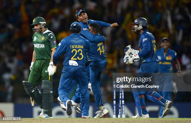 Rangana Herath of Sri Lanka celebrates with Mahela Jayawardene after bowling Shahid Afridi of Pakistan during the ICC World Twenty20 2012 Semi Final...