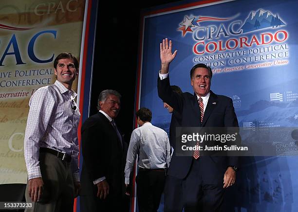 Republican presidential candidate, former Massachusetts Gov. Mitt Romney waves as his son Matt Romney looks on during the regional Conservative...