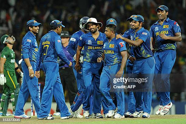 Sri Lanka's Rangana Herath celebrates dismissing Pakistan's Shahid Afridi during the ICC Twenty20 Cricket World Cup's semi-final match between Sri...