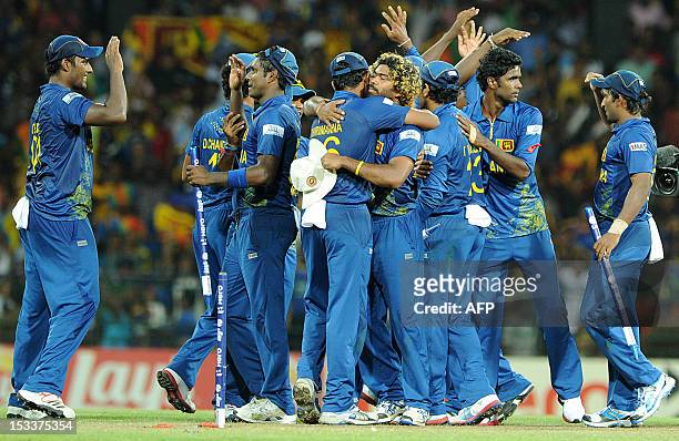 Sri Lanka's cricket team celebrates its victory during the ICC Twenty20 Cricket World Cup's semi-final match between Sri Lanka and Pakistan at the R....