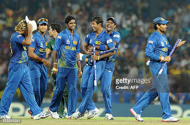 Sri Lanka's cricket team celebrates its victory during the ICC Twenty20 Cricket World Cup's semi-final match between Sri Lanka and Pakistan at the R....