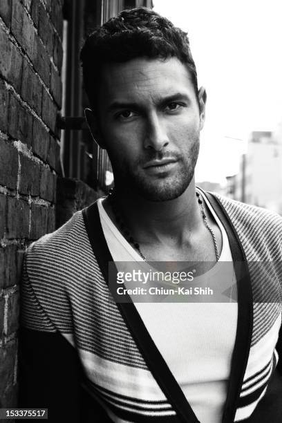 Model/actor Noah Mills poses for August Man on March 24, 2012 in New York City.