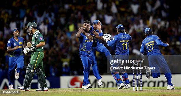 Angelo Mathews of Sri Lanka celebrates the dismissal of batsman Kamran Akmal of Pakistan during the ICC T20 World Cup cricket semi final match...