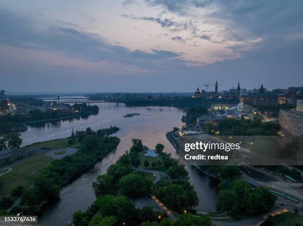 aerial drone shot of victoria island, ottawa river, gatineau and ottawa downtown - ottawa night stock pictures, royalty-free photos & images