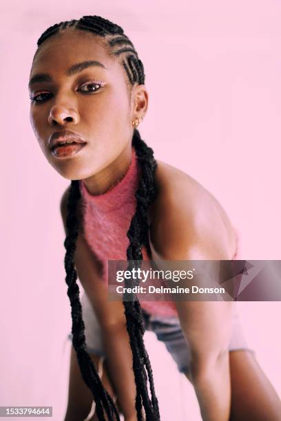 she's cooler in pink stock photo - bending over stock pictures, royalty-free photos & images