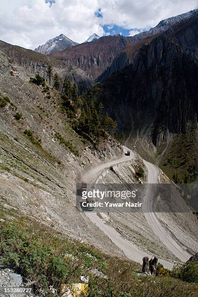 Truck carries supplies to Ladakh on a treacherous road of Zojila Pass before the foundation stone-laying ceremony for a tunnel on the Srinagar-Leh...